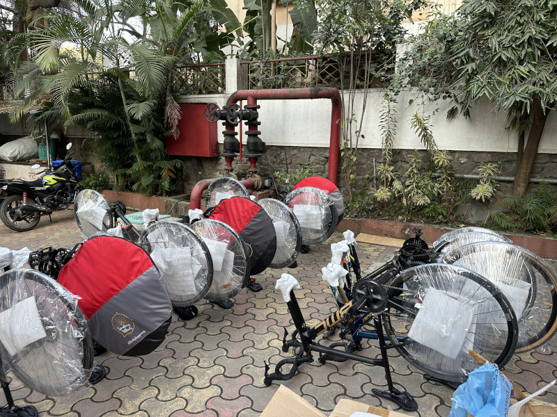 Bicycles packed and and being loaded for transport to Bhuj.