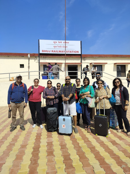 Ladies group photo on the railway platform.